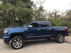 2017 Chevy 1500, 3in. Rough Country lift, 33x12.50x22 Nitto Ridge Grapplers on factory wheels with 1 1/4 hubcentric spacers