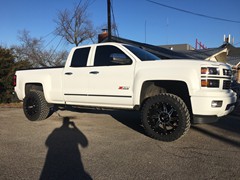 2015 Chevy Silverado 1500 with Rough Country 3.5 inch lift kit with 20x10 inch American Truxx AT162 Vortex wheels and 33 inch Atturo Trail Blade MT tires
