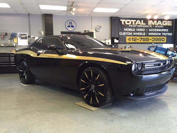 2015 Dodge Challenger with custom Gold Chrome vinyl graphics and 22 inch Lexani CSS-15 wheels with Gold Chrome accents.  2 Kicker Comp R 12 inch subs with Kicker KX800.1 amp. 
