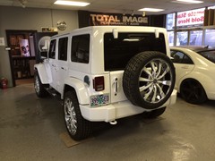 2014 Jeep Wrangler with 24 inch Helo 875 wheels, Nitto Terra Grappler tires 285/40/24.  Front and rear bumpers, mirrors, door handles, all trim and wheel inserts painted to match.  J-02241404