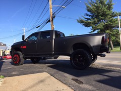 2012 Ram 3500 with full Matte Black vinyl wrap, custom red emblems, 24 inch American Force Dolla wheels (custom painted) with 37x13.50x24 Toyo Open Country MT tires.  Custom made Oracle headlights, Fog Lights, and LED light bar