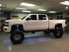 2016 Chevy Silverado 2500HD with 12 inch Cognito lift kit, 22x14 Fuel Forged FF19 wheels and 40x15.50x22 Toyo Open Country MT tires.  Rigid Industries 40 inch LED light bar custom mounted in the front bumper, Rigid Industries Dually XL fog light conver...