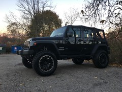 2017 Jeep Wrangler with 4 inch Zone Offroad lift and 20 inch Black Rhino Razorback wheels and 35 inch Ironman MT tires